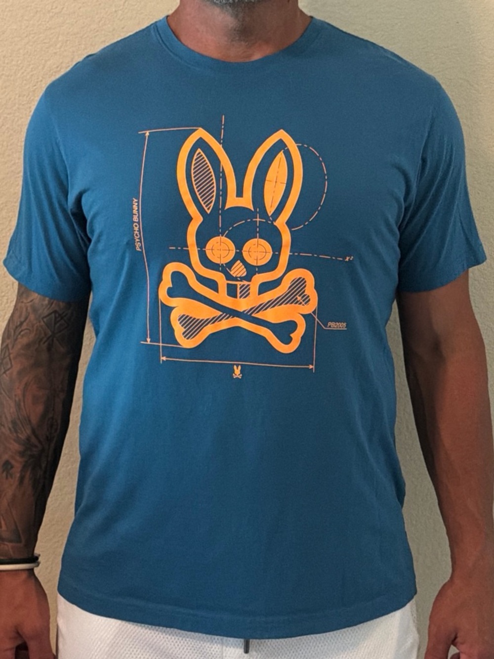 Psycho Bunny Teal Short-Sleeve Tee with Orange Skull-and-Crossbones Bunny